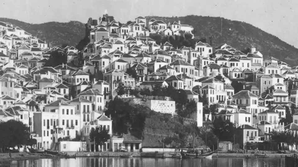 Old black-and-white photograph of Skopelos Town seen from the water